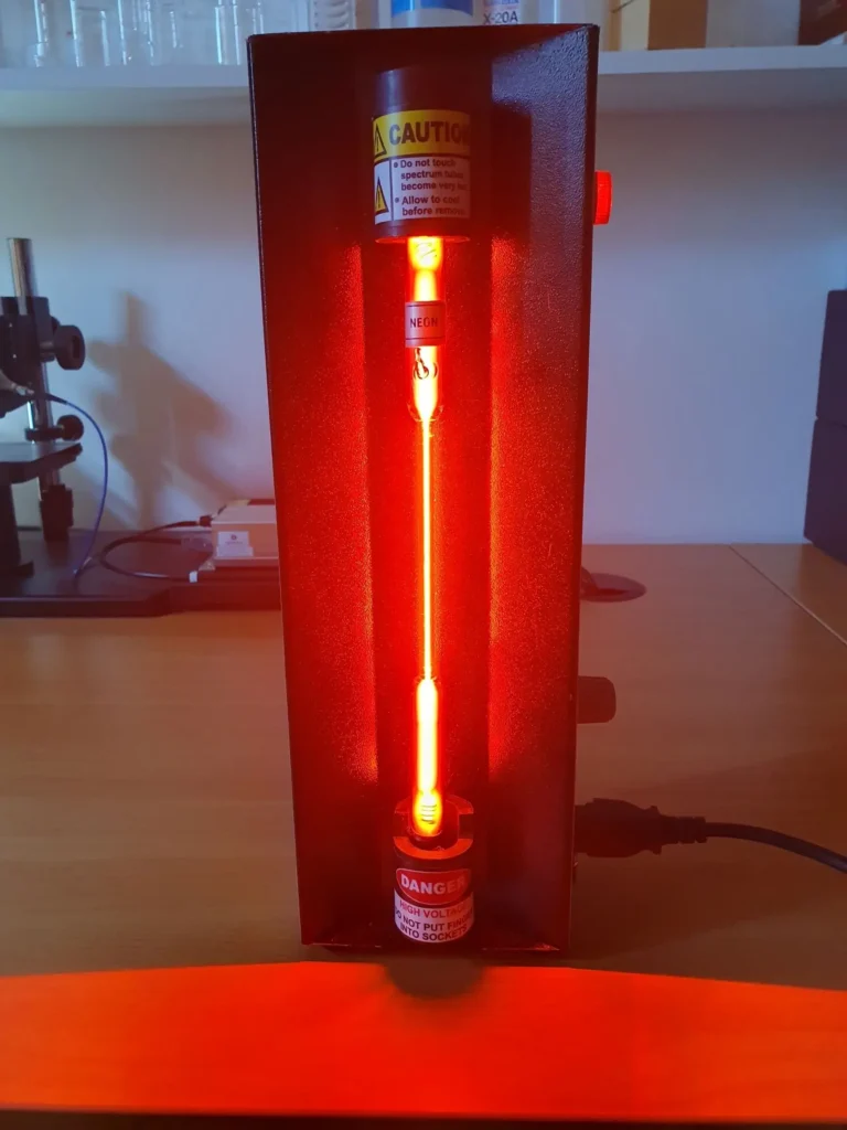 Ne glow discharge at low pressure